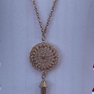 Tassel Necklace goldtone round filigree pendant 21” long